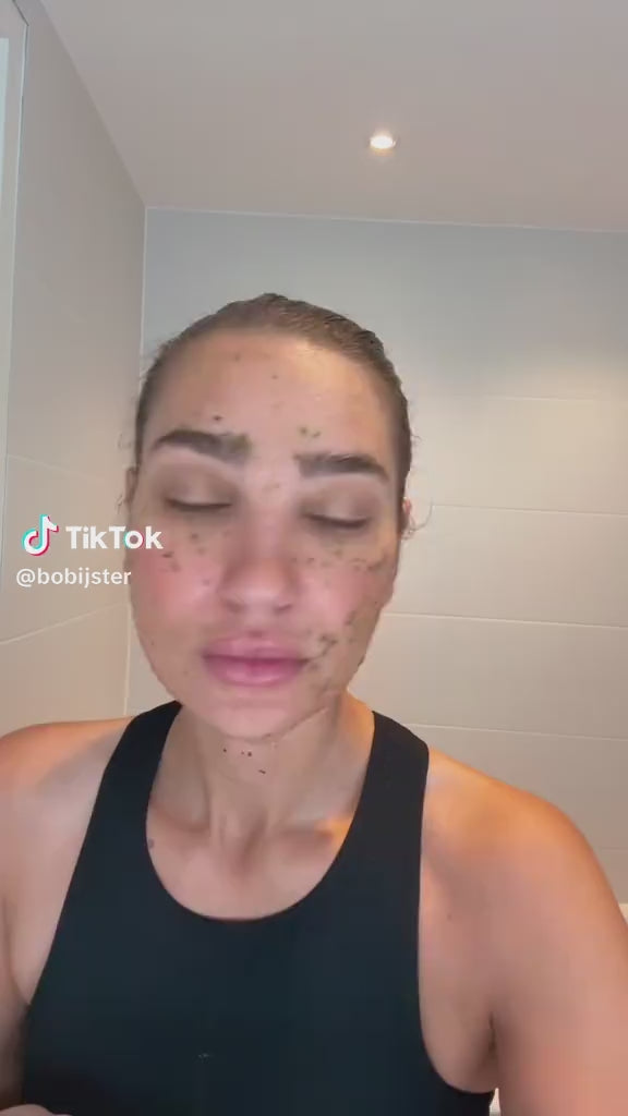 Woman using Glowhaus Sculpt Bar cucumber  – ice facial tool