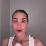 Woman using Glowhaus Sculpt Bar on jawline – ice facial tool