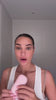 Woman using Glowhaus Sculpt Bar on jawline – ice facial tool
