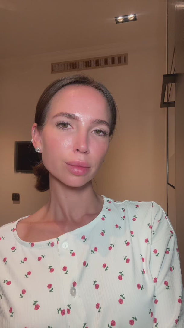 Woman using Glowhaus Sculpt Bar on jawline – ice facial tool