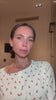 Woman using Glowhaus Sculpt Bar on jawline – ice facial tool